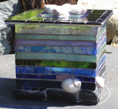 Dog Whelk Lantern;  stone, shells, stained glass on glass; 5" square;  interior light. $100.00
